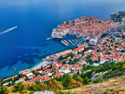Aerial view at famous european travel destination in Croatia, Dubrovnik old town, Dalmatia, Europe. UNESCO list. Beautiful sunset view over the historic old Fort Bokar seen in dramatic light. Roofs. Postcard
